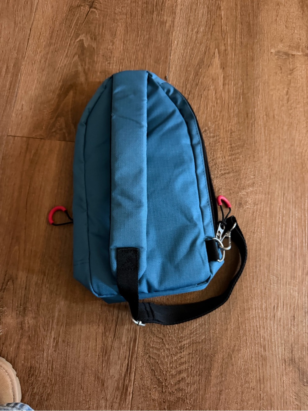 Disney Teal Sling Belt Bag with Pink Accent Pulls